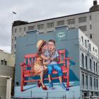 'Love is in the Air' was painted on the  side of   Mansfield Apartments in 2015 by Polish artist...