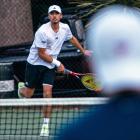 Ben McLachlan plays a shot to Kai Milburn (foreground) in their fundraising match at Queenstown...