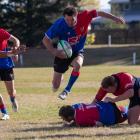 Maniototo centre Quinton Smith skips away from the Cromwell defence during the Central Otago...