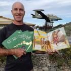 Wānaka writer Toby Butland with his second children's book, Fittall the Flyer, which is a...