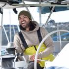 SV Parlay captain Colin MacRae at the helm of his 2012 Lagoon 450 catamaran in Dunedin yesterday....
