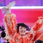 Switzerland's Nemo appears on stage after winning during the Grand Final of the 2024 Eurovision...