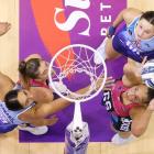 Southern Steel shooter Grace Namana takes a shot under the pressure of Mystics defender Phoenix...