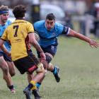 Raf Tuhura prepares to swerve past an Upper Clutha defender. PHOTO: SUPPLIED