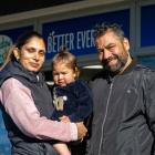 Thames Discounter and Takeaways owners Tania and Sunny Bal with daughter Grace, 2, outside the...