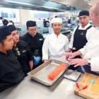 International chef Tony Smith coaches his team — Margaret Magdurulan, Princess Docto, Madelyn Ma,...
