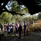 New Zealand Heritage Properties senior archaeologist Bree Wooller (left, foreground) presents a...