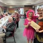 Alexandra Senior Citizens co-ordinator Jo Ireland gives Ariana Ridley from the Cancer Society the...