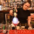 Jaz Stoddart shows how to make Pequeno’s smoke bubble peach cosmo. PHOTO: GREGOR RICHARDSON