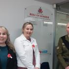 Unveiling the honours board at the school during a dawn Anzac service are (from left) St Peter’s...