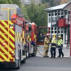 Fire and Emergency NZ personnel at the scene in North Dunedin. Photo: Peter McIntosh