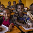 Children enthusiastically wait for school to start in their isolated village in southern Ethiopia...