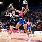 Grace Namana hauls in the ball against Mainland Tactix defender Jane Watson during an ANZ...