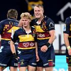 Highlanders Finn Hurley (L) and Sam Gilbert celebrate during their match against the Crusaders in...