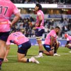 Rebels players react during their round 14 Super Rugby Pacific match against the Brumbies in...