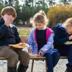 Enjoying  some kai at the recent Omarama Station hāngi are (from left) Arlo Leopold, 8, Amelia...