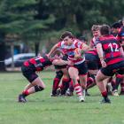 Burnside halfback and co-captain Joel Lam tries to break a tackle during his side’s 45-7 win over...