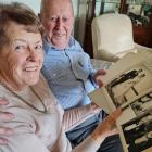 Wānaka retirees Eleanor, 85, and John, 86, Lischner look through photographs from their wedding...