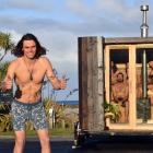 Oranga Saunas founder Josiah Lilburne tries out his portable sauna at Brighton Beach. PHOTO:...