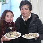 Delighted with the oysters at the Bluff Oyster and Food Festival on Saturday are Moe Imamura ...