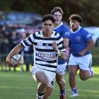 Otago Boys’ winger Manaia Lesa races away from the Southland Boys’ defence during the First XV...