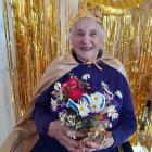 Although Raewyn Wylie had not yet received her card from King Charles, she looked regal and royal...