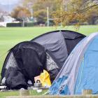A homeless woman in a tent at the Oval walks with a crutch, yet has been waiting for a state home...