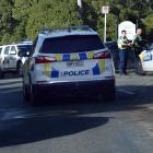 Police at the entrance of the Andersons Bay Cemetery on Tomahawk Rd this afternoon. Photo: Peter...