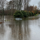 The woman was rescued from her care and it was submerged to its roof minutes later. Photo:...
