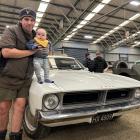 Andrew Johnston and his 7-month-old son George were at the Ute Muster on Sunday. where Mr...