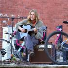 Dunedin musician Sam Charlesworth shares music in Albany St after plugging his amplifier into an...