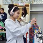 Dunedin student Irris Etches, 20, looks at clothing at the Super Swap Saturday event, part of...