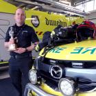 Dunedin Airport Emergency Services blue watch chief Clint Hagan shows his kit, weighing about...