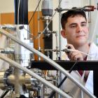 University of Otago chemistry PhD student Tait Francis conducts an experiment using the...