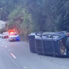 A runaway 4WD lies on its side after rolling over in North Rd at about 4pm on Saturday. Photo:...