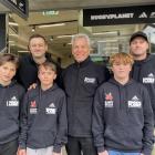 Back row, from left, are Rugby Planet owners James Barratt and Miles Wilson and co-coach Jamie...