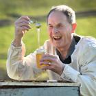 Allan (Allen) McCaw, of Milburn, shows off some of his award-winning honey in 2019. PHOTO: PETER...