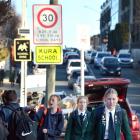 A temporary 30kmh speed limit (inset) around Columba College in Dunedin will soon be extended by...