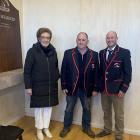Warren Jones, centre, after receiving his life membership from Sue Edgerton — whose husband Ewen ...