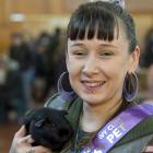 Alex Gibbon, of Dunedin, holds Tom Bombadil, judged the best senior pet in the Otago Cavy Club...