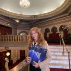 New Zealand International Film Festival Dunedin publicist Dallas Synnott holds some of the stacks...