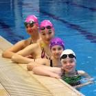 Finding a common bond in the water are artistic swimmers (from left) Daisy Sellier, Hannah...