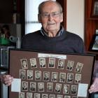 Rex Sim shows a collection of photos of the 1924 "Invincibles" team he is hoping to sell to a...