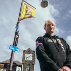 Queenstown Winter Pride co-director Sam Coulthard stands in front of a surviving Winter Pride...