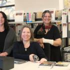 Library staff, including (from left) Kelly Campbell, Jaimie Phipps and Mo Fenton, have settled...