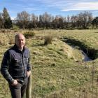 Pomahaka Water Care Group co-ordinator Craig Simpson wants to transform this paddock on the edge...