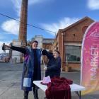 Dunedin Gasworks Market co-ordinator Chris Edwards measures up Gasworks Museum Trust chairman...