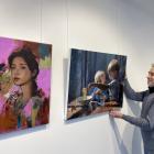 Otago Art Society councillor and exhibition lead for "The Ultimate Showcase" Rob McGee adjusts...