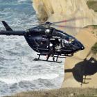 A woman was winched by helicopter from the shore at Tunnel Beach yesterday after three members of...