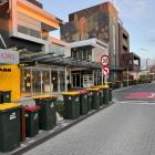 Rubbish bins on Burnett St about 7am on Tuesday. Photo: Supplied